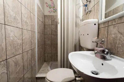 a bathroom with a toilet and a sink at Apartment Natasha in Budva