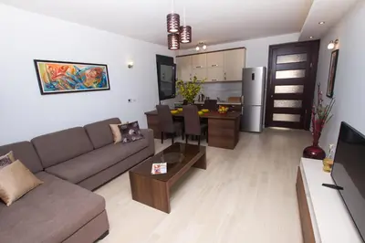 a living room with a couch and a table at Apartment Ema Star in Utjeha