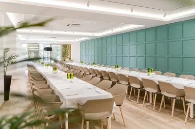 a conference room with white tables and chairs at Dukley Hotel & Resort in Budva