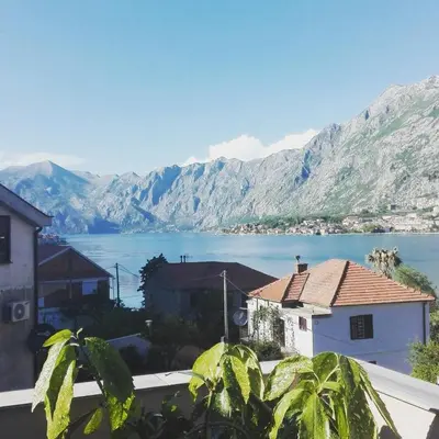 a view of a large body of water with mountains at Apartmani Mizdrak in Kotor