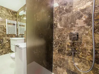 a bathroom with a shower and a toilet at Luxury Apartment Valentina in Budva