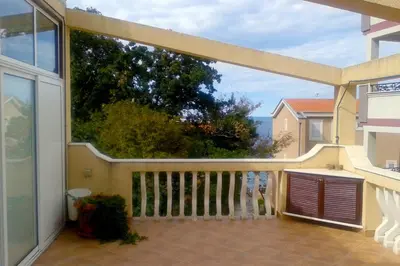 a balcony with a view of the ocean at Apartments Esperanza in Utjeha