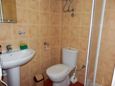 a bathroom with a toilet and a sink at Apartments Esperanza in Utjeha