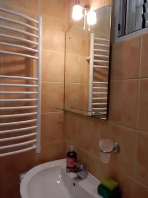a bathroom with a sink and a mirror at Apartments Esperanza in Utjeha
