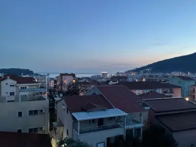 a view of a city at night with buildings at Korolev Apartment in Budva