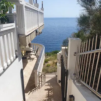 a balcony with a view of the ocean at Villa Apartmani Anja in Dobra Voda