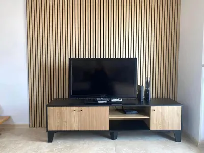 a flat screen tv sitting on top of a wooden entertainment center at Apartment Talas in Budva