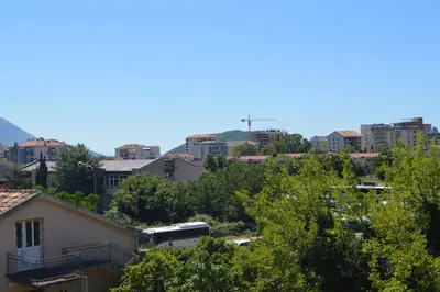 a view of a city with a bus at Apartment Talas in Budva
