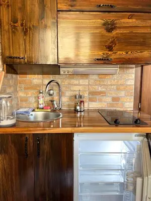 a kitchen counter with a sink and a sink at Una apartments in Kotor