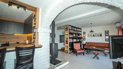 an open kitchen and living room with a fireplace at Lux Apartment Sunset in Virpazar