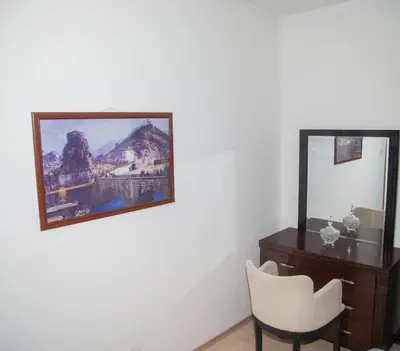 a room with a desk and a mirror and a chair at Lux Apartment Sunset in Virpazar