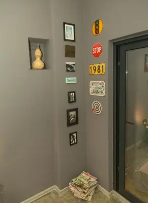 a room with a stop sign and pictures on the wall at Lux Apartment Sunset in Virpazar