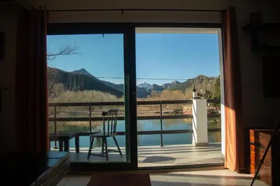 a sliding glass door with a view of a balcony at Lux Apartment Sunset in Virpazar