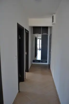 a hallway of an apartment with open doors at Old Town View Apartment in Budva