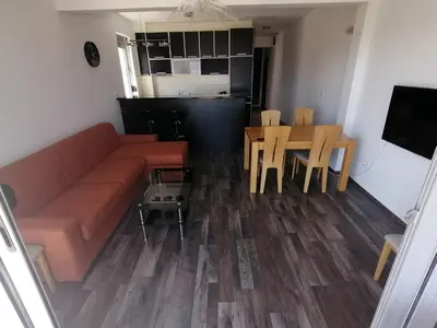 a living room with a couch and a table at Old Town View Apartment in Budva