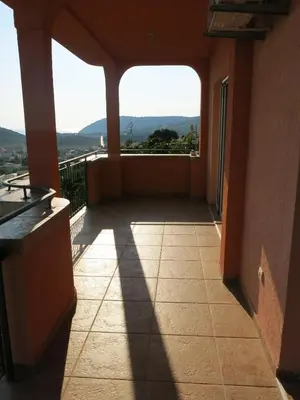 a room with a balcony with a view at Apartments Victoriya in Sutomore