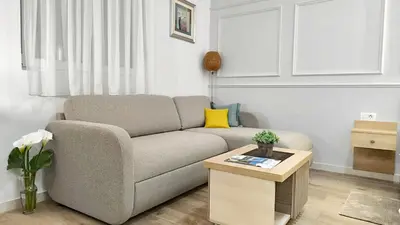 a living room with a couch and a table at Apartments Gruda in Cetinje