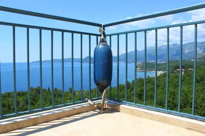 a balcony with a view of the ocean at Blue Mediterranean Apartments in Sveti Stefan
