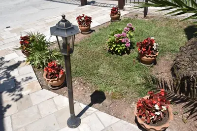 a street light next to a group of potted plants at Studio Apartments 6 Palmi in Budva