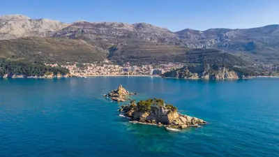 an island in the middle of a large body of water at Home Apartment Petrovac in Petrovac na Moru