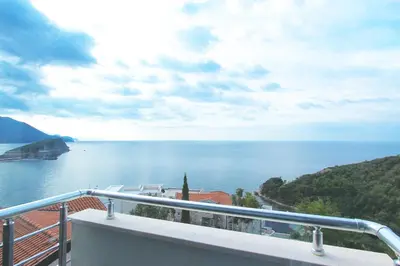 a view of the ocean from a balcony at Apartments Aqua in Budva