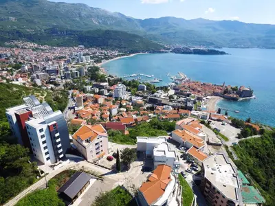 an aerial view of a city and a body of water at Apartments Aqua in Budva
