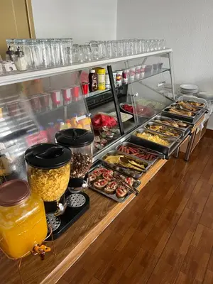 a refrigerator filled with lots of different types of food at Apartments Fat e Jet - Pool & Breakfast in Ulcinj