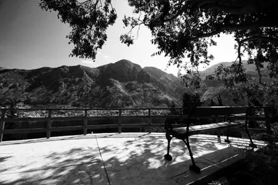 a bench sitting in front of a view of mountains at Villa Mima in Kotor