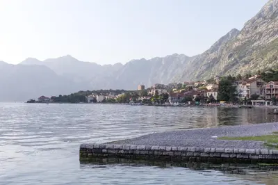 a large body of water with mountains in the background at Apartman Kotor in Kotor