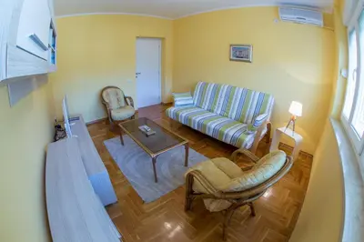 a living room with a couch and a table at Apartman Kotor in Kotor