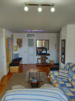 a living room with a couch and a table at Apartman La Siesta in Bar
