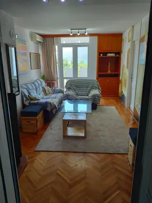 a living room with a couch and a coffee table at Apartman La Siesta in Bar