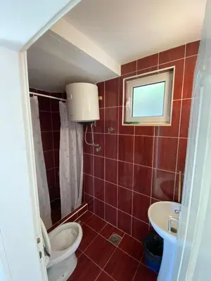 a bathroom with a toilet and a sink at Apartments Klikovac Liman II in Ulcinj