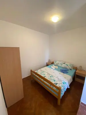a small bedroom with a bed in a room at Apartments Klikovac Liman II in Ulcinj