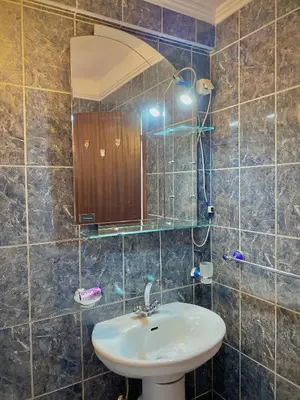 a bathroom with a sink and a mirror at Apartments Klikovac Liman II in Ulcinj