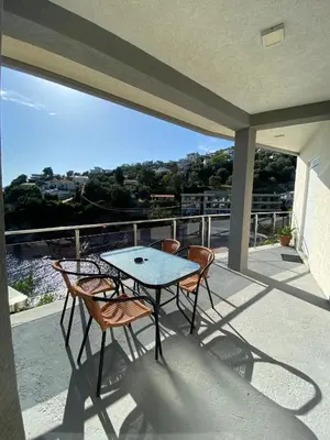 a patio with a table and chairs on a balcony at Apartments Klikovac Liman II in Ulcinj