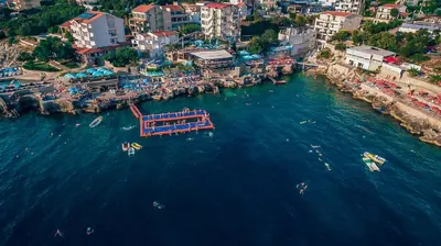 an aerial view of a city with boats in the water at Apartments Limunada in Utjeha