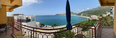 a balcony with a view of the ocean at Monterama Apartments in Sutomore