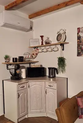 a kitchen with white cabinets and a counter top at Apartments Peranovic 2 in Kotor