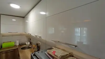 a small kitchen with a sink and a stove at Apartment Maja in Budva