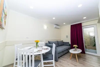a living room with a couch and a table at Milara Apartments in Budva
