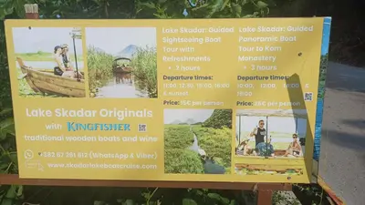 a sign for the lakeoster originals with a boat at Draga`s rooms in Virpazar