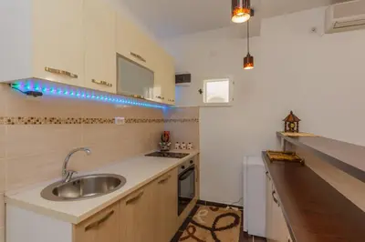a kitchen with a sink and a counter top at Apartment Ines in Bar