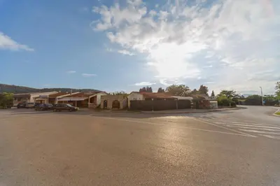 an empty street in a town with a cloudy sky at Apartment Ines in Bar