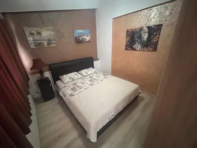 a bedroom with a bed and pictures on the wall at Apartment Ines in Bar