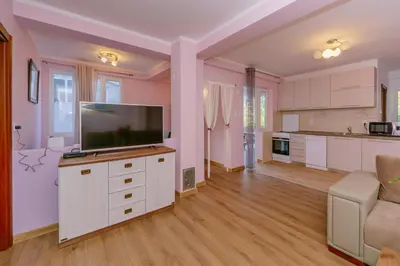 a large living room with a flat screen tv at Paradise Bay Apartments in Kotor