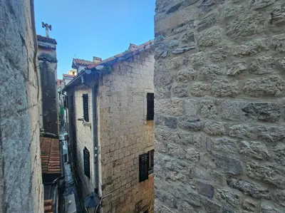 an alley in an old stone building at Athos Guesthouse in Kotor