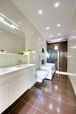 a white bathroom with a toilet and a sink at Spa Hotel Montefila in Ulcinj