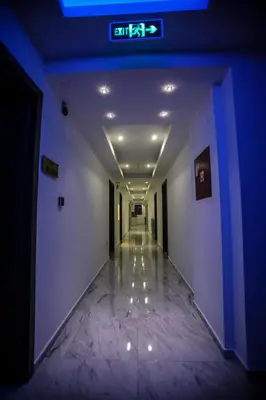 an empty hallway with a clock on the ceiling at Spa Hotel Montefila in Ulcinj
