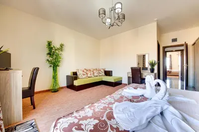 a living room with a bed and a couch at Spa Hotel Montefila in Ulcinj